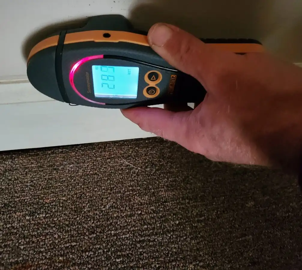 Moisture detection at baseboard during Storm Damage Restoration in Connellsville